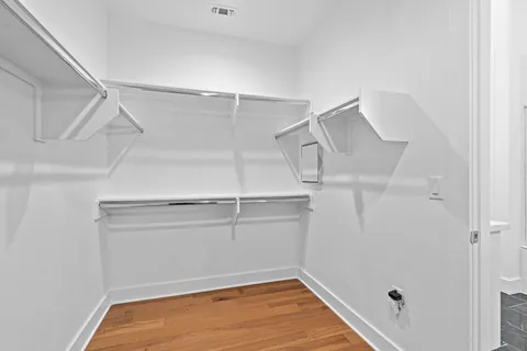 a view of an empty walk in closet