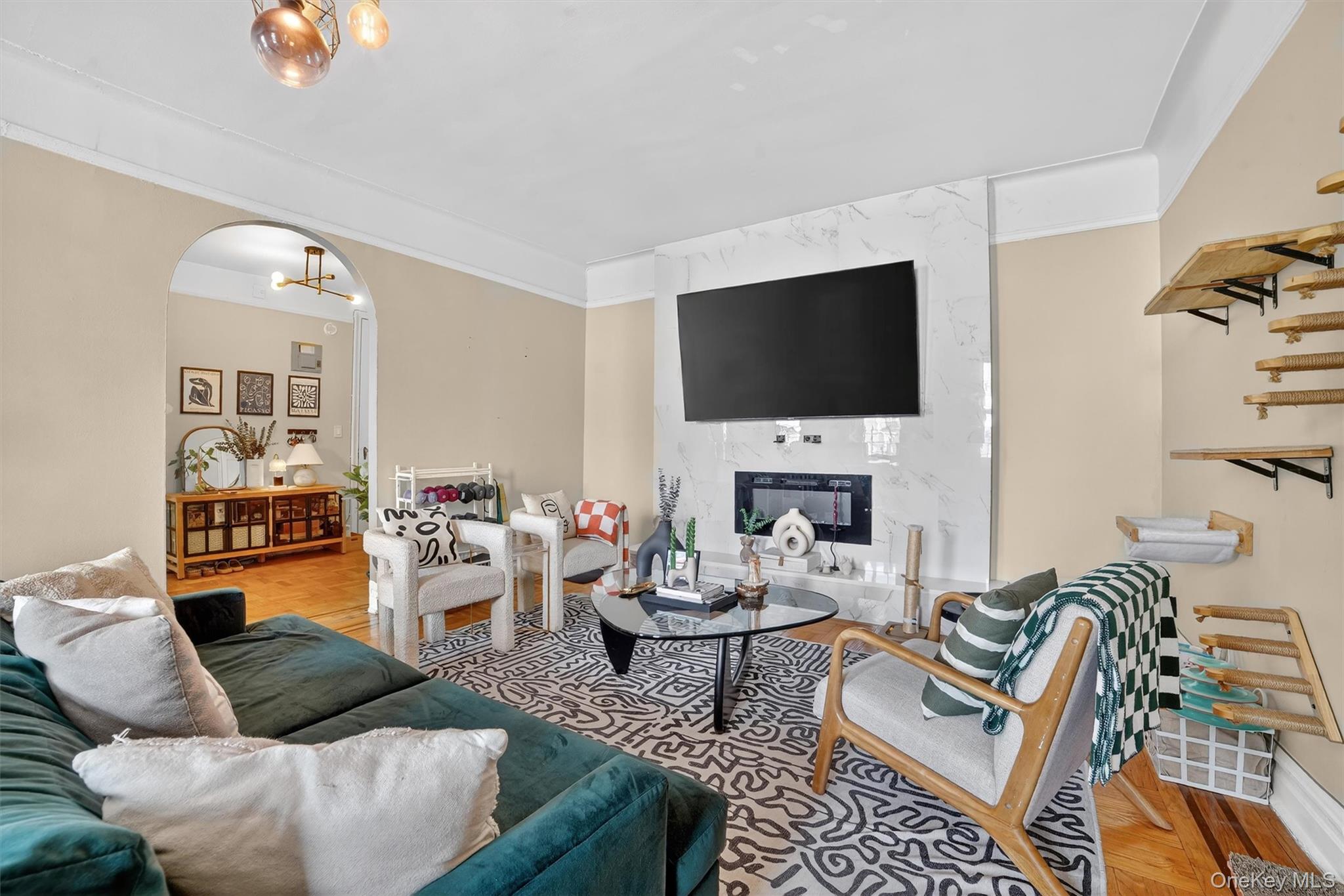 219 Bronx River Road, Unit 4N Yonkers, NY 10704 - Photo 10 of 30 a living room with furniture and a flat screen tv