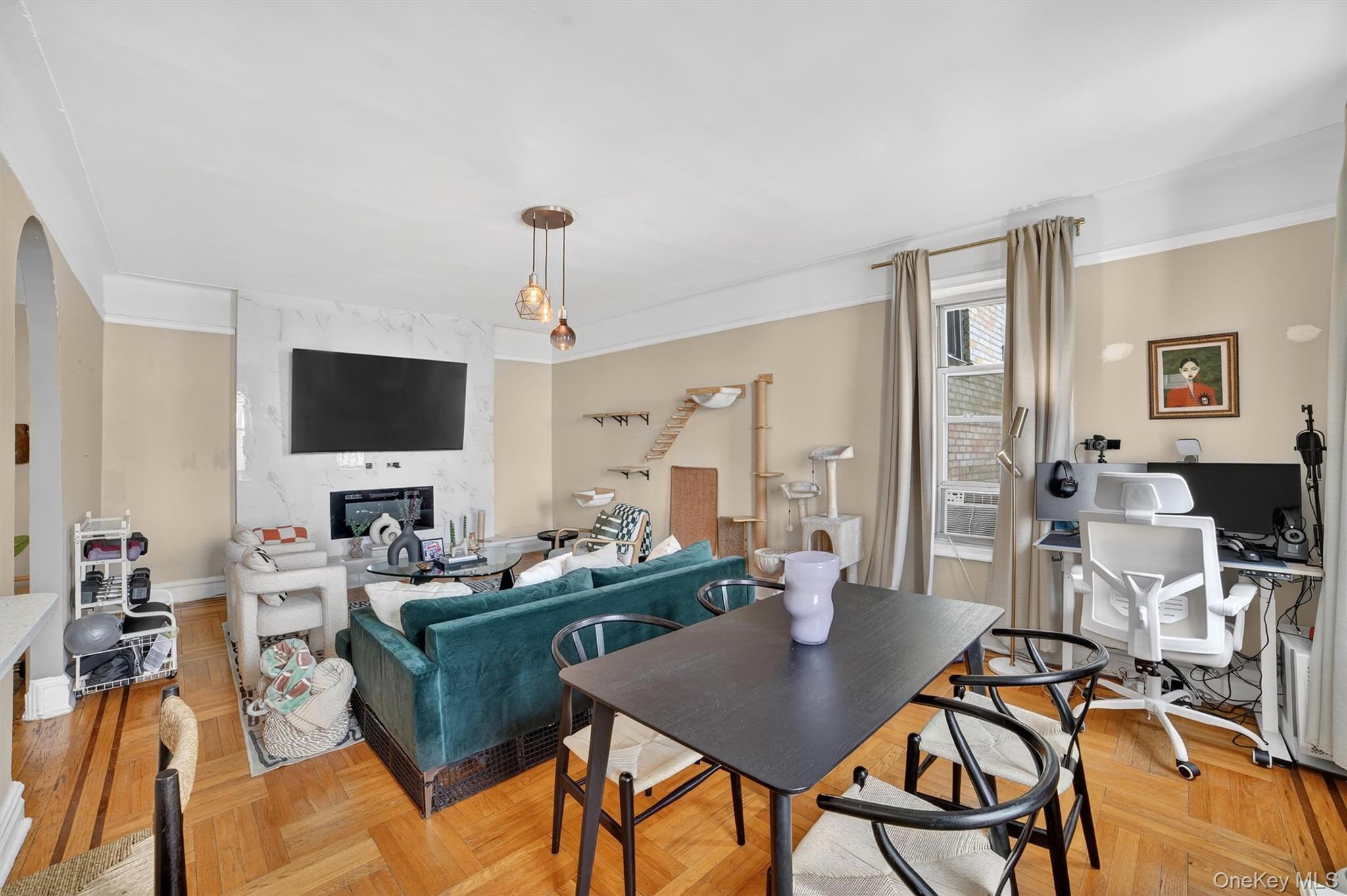 219 Bronx River Road, Unit 4N Yonkers, NY 10704 - Photo 13 of 30 a living room with furniture a flat screen tv and kitchen view