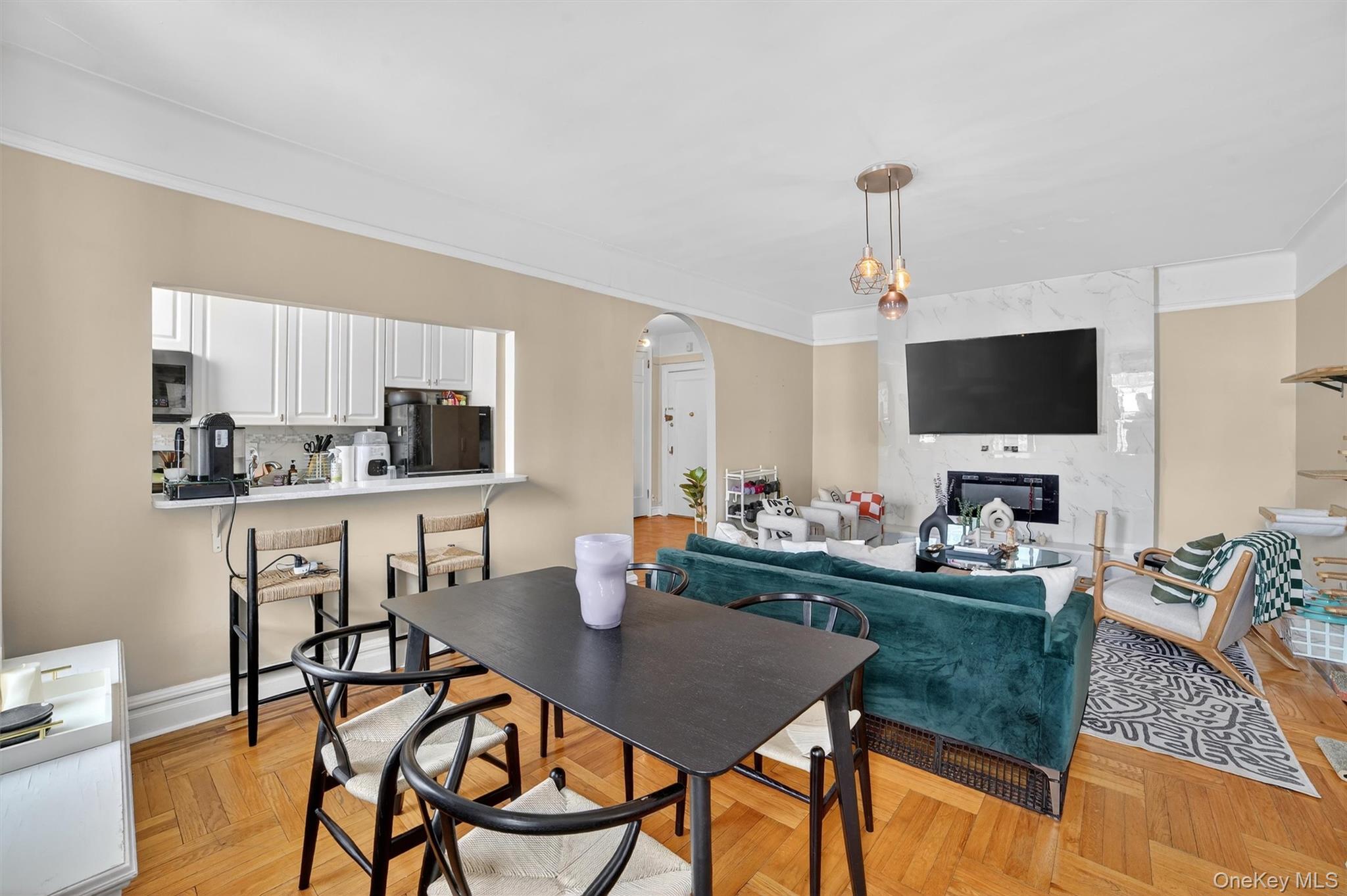 219 Bronx River Road, Unit 4N Yonkers, NY 10704 - Photo 15 of 30 a kitchen with a dining table and chairs