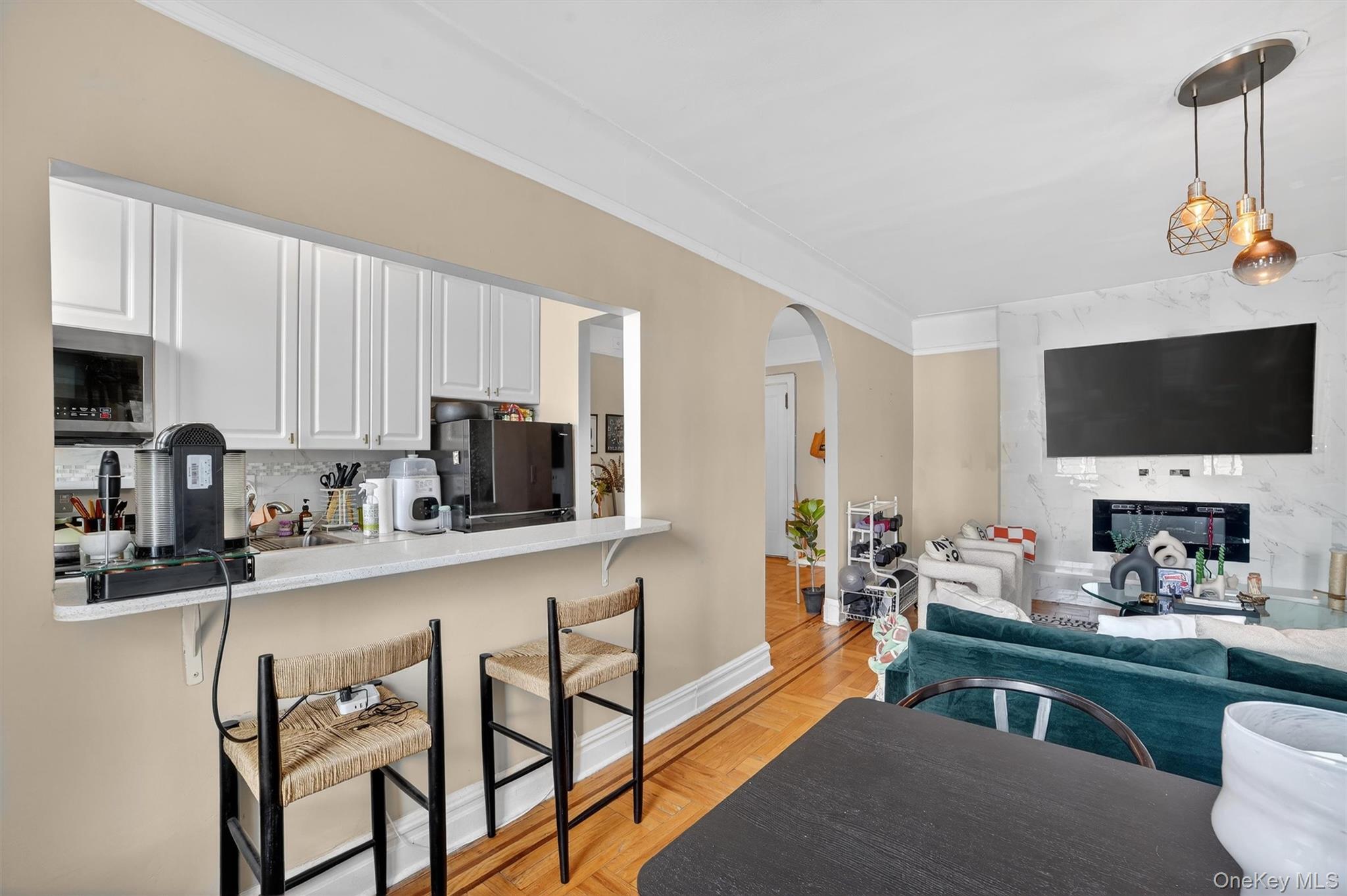 219 Bronx River Road, Unit 4N Yonkers, NY 10704 - Photo 16 of 30 a kitchen with stainless steel appliances granite countertop a sink and a stove