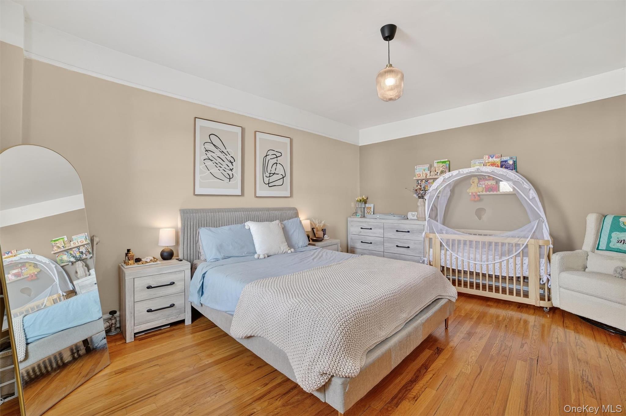 219 Bronx River Road, Unit 4N Yonkers, NY 10704 - Photo 22 of 30 a bedroom with a bed and a dresser