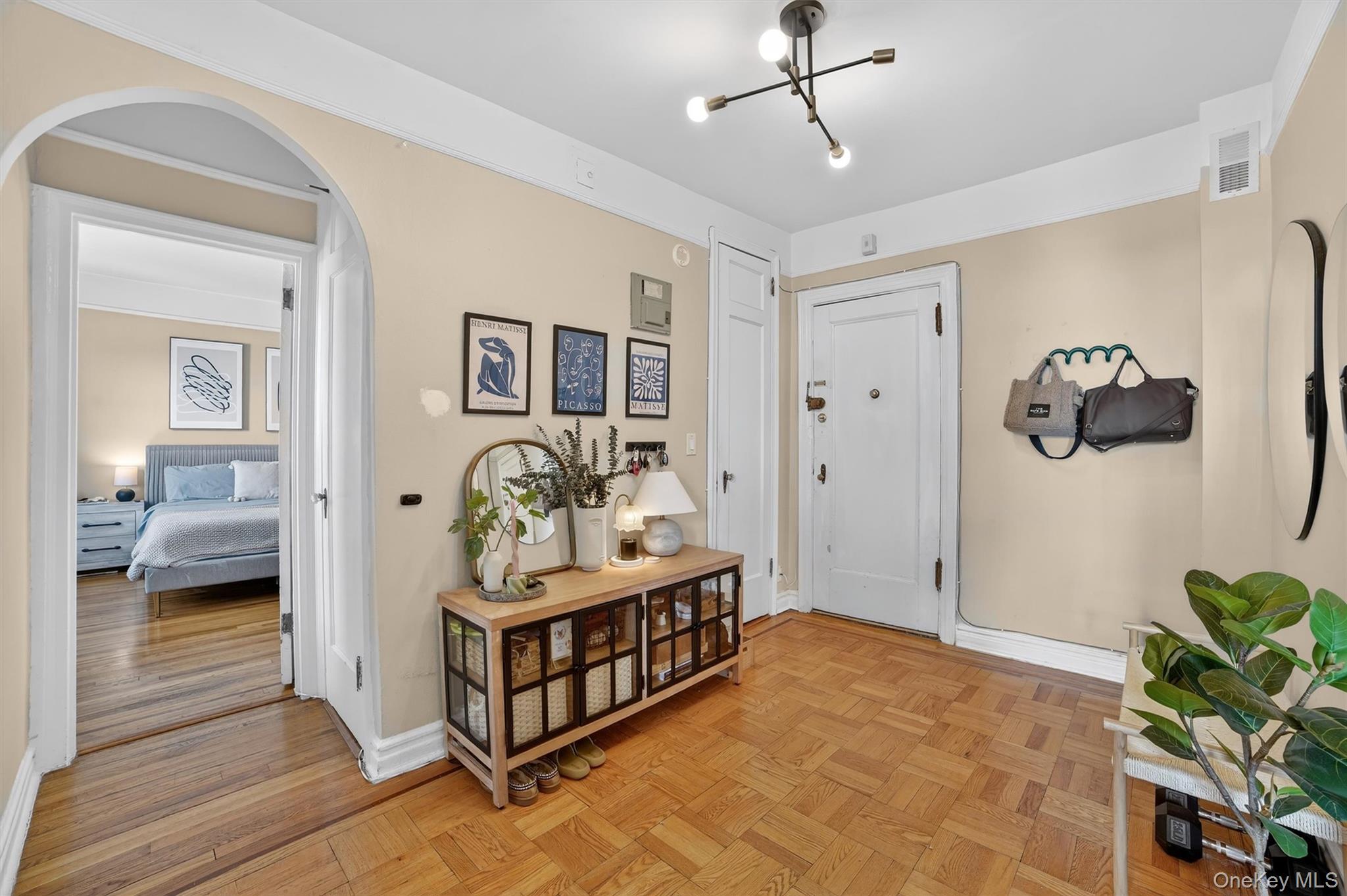 219 Bronx River Road, Unit 4N Yonkers, NY 10704 - Photo 3 of 30 a bedroom with a bed and a hallway