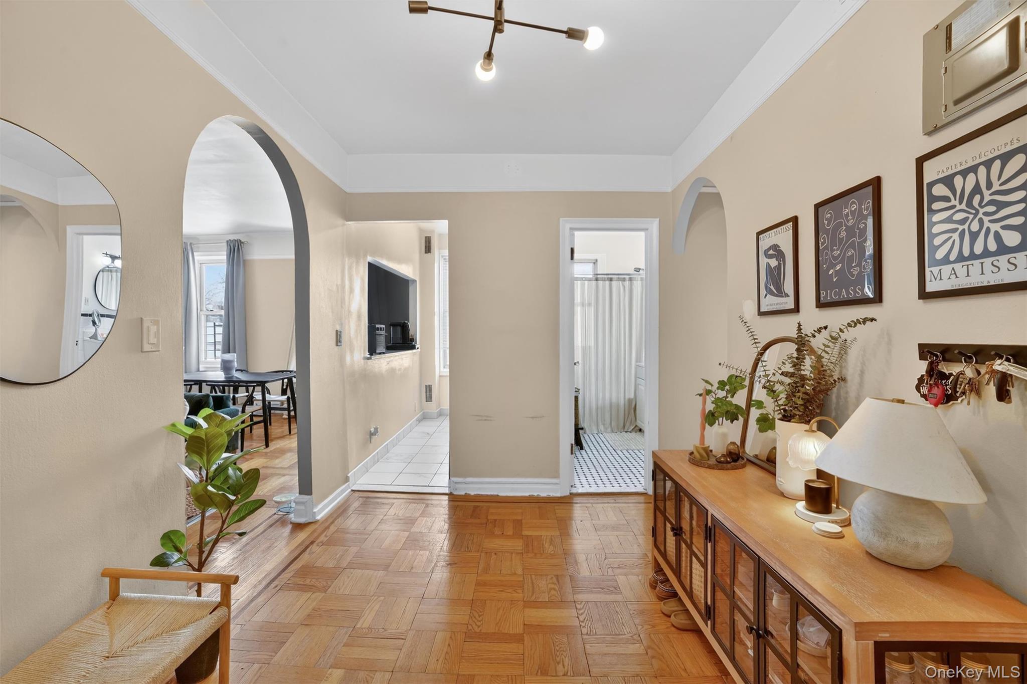 219 Bronx River Road, Unit 4N Yonkers, NY 10704 - Photo 4 of 30 a living room with furniture and a potted plant