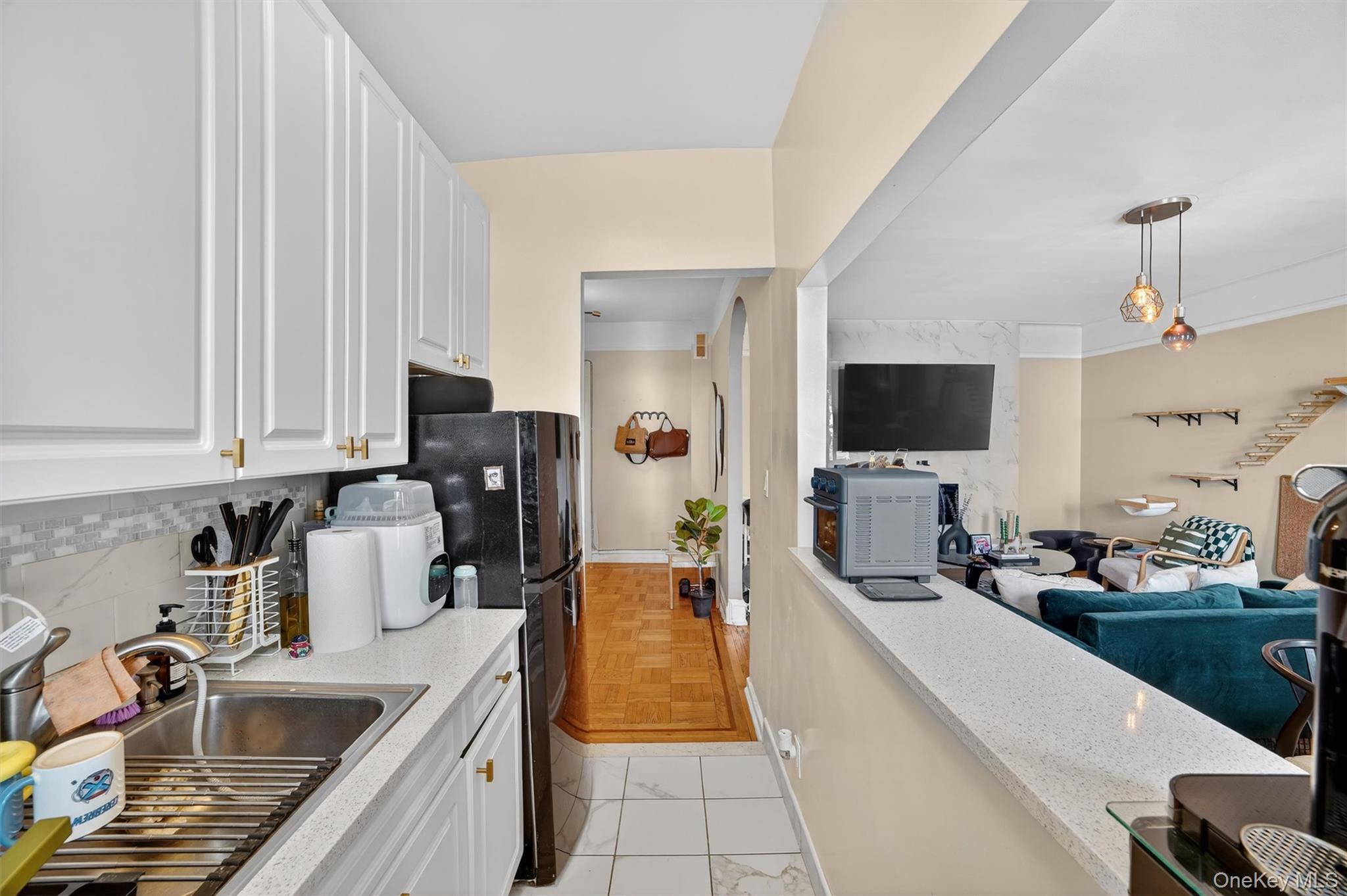 219 Bronx River Road, Unit 4N Yonkers, NY 10704 - Photo 30 of 30 a kitchen with granite countertop a sink and a stove top oven