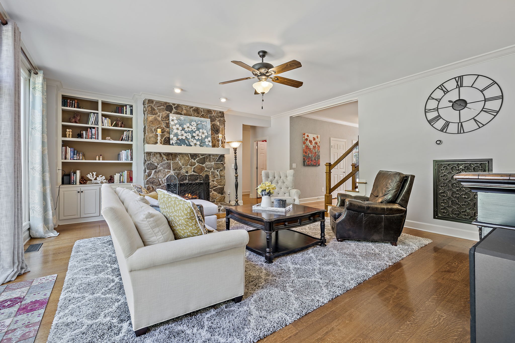 1420 Hunter Road Franklin, TN 37064 - Photo 12 of 57 a living room with furniture and a fireplace