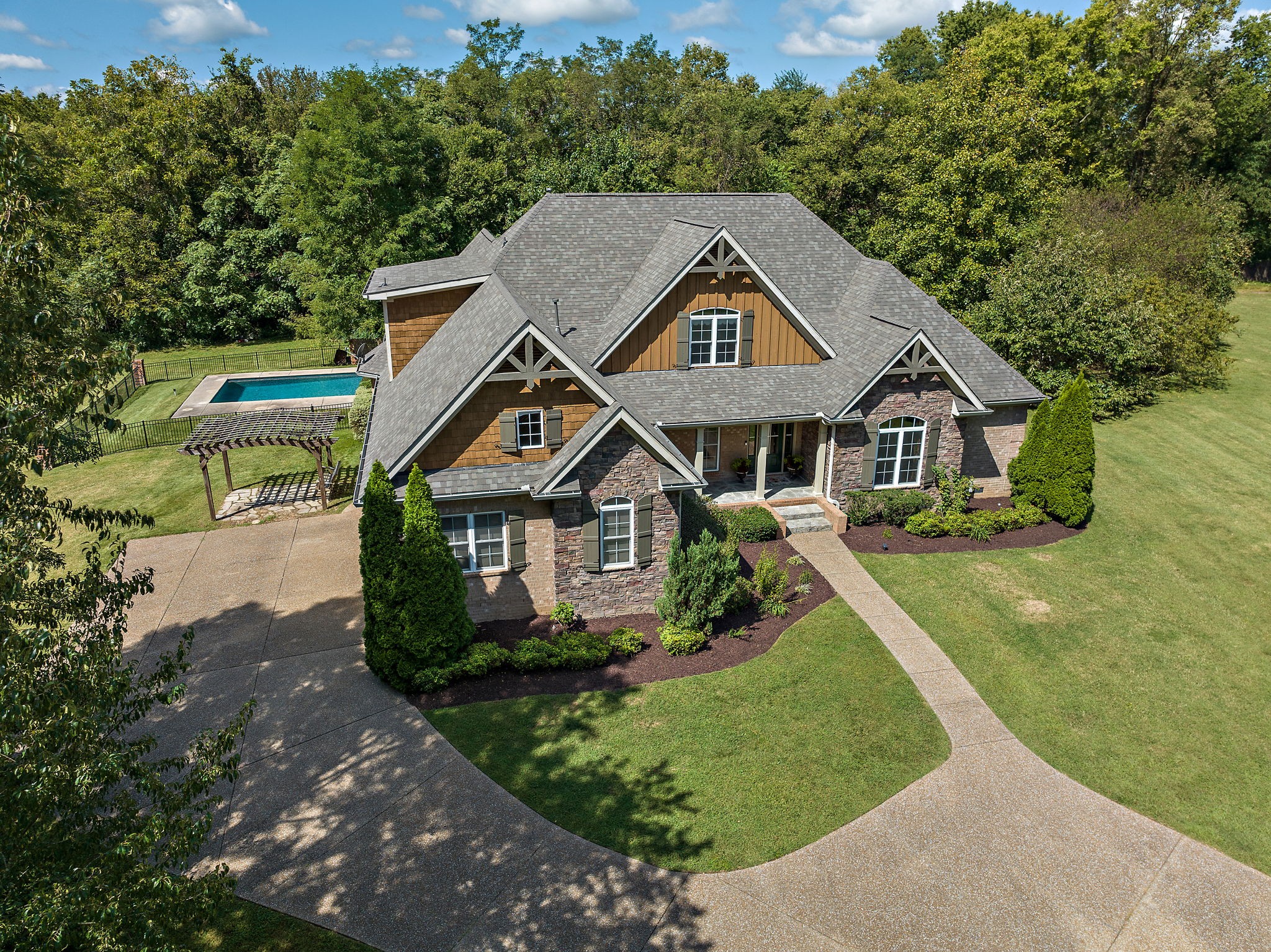 1420 Hunter Road Franklin, TN 37064 - Photo 4 of 57 a front view of a house with a yard
