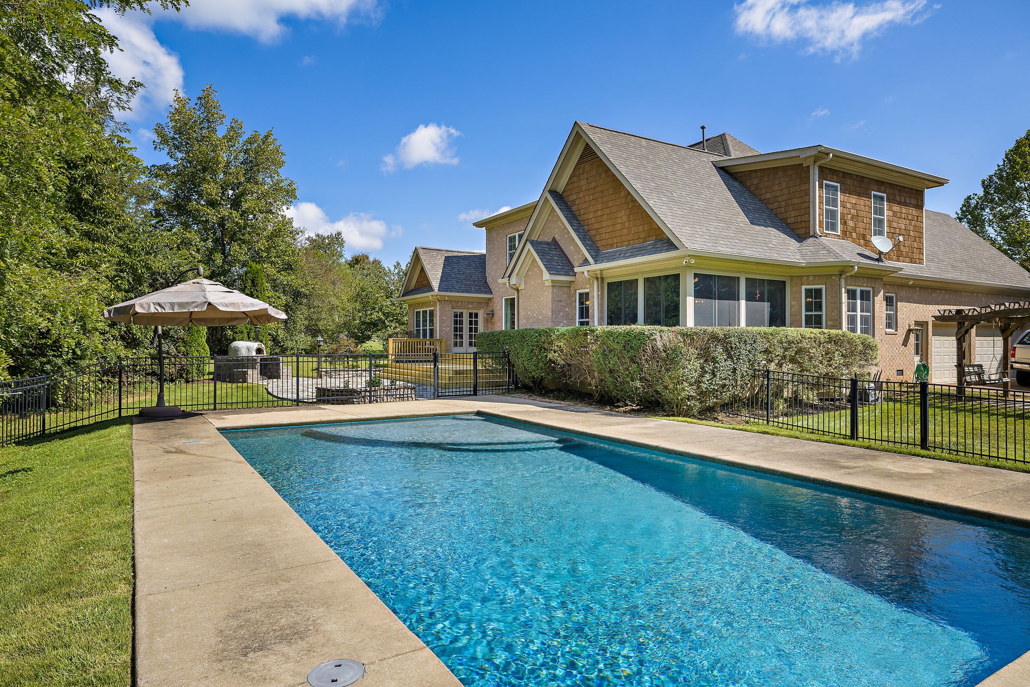 1420 Hunter Road Franklin, TN 37064 - Photo 45 of 57 a front view of a house with swimming pool having outdoor seating