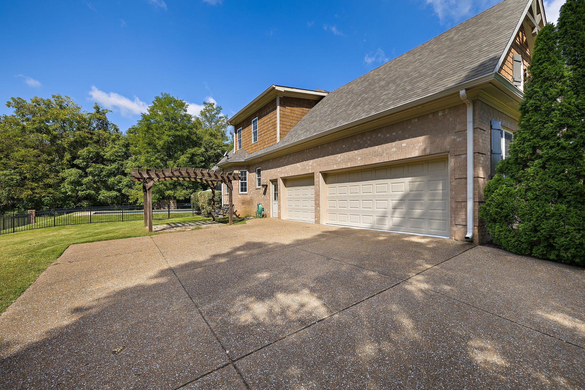 1420 Hunter Road Franklin, TN 37064 - Photo 49 of 57 a view of a house with a yard and garage