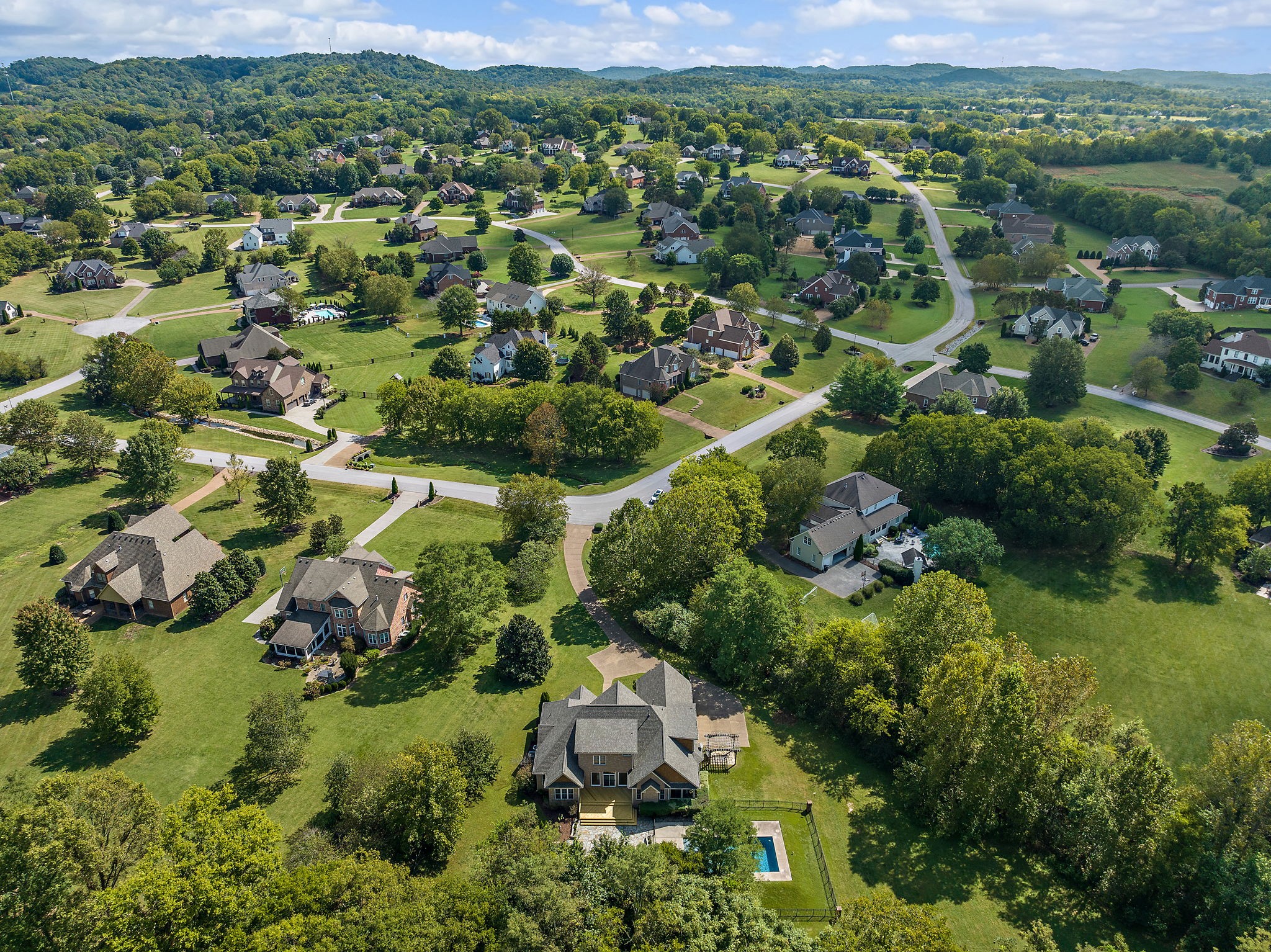 1420 Hunter Road Franklin, TN 37064 - Photo 56 of 57 an aerial view of residential houses with outdoor space and trees