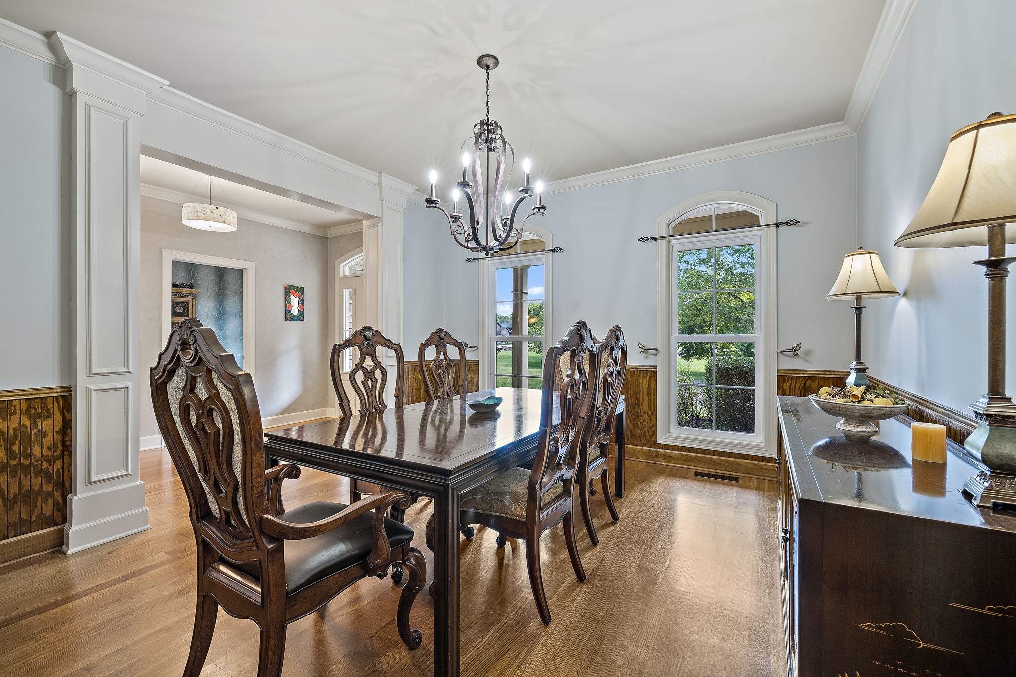 1420 Hunter Road Franklin, TN 37064 - Photo 6 of 57 a view of a dining room with furniture a chandelier and wooden floor