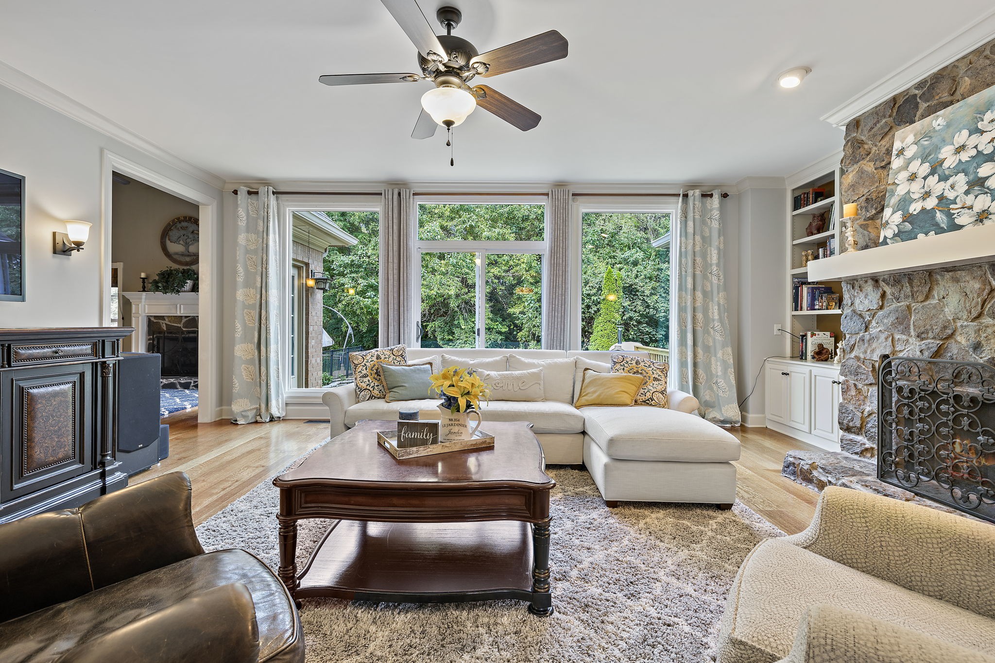 1420 Hunter Road Franklin, TN 37064 - Photo 10 of 57 a living room with furniture large windows and a fireplace