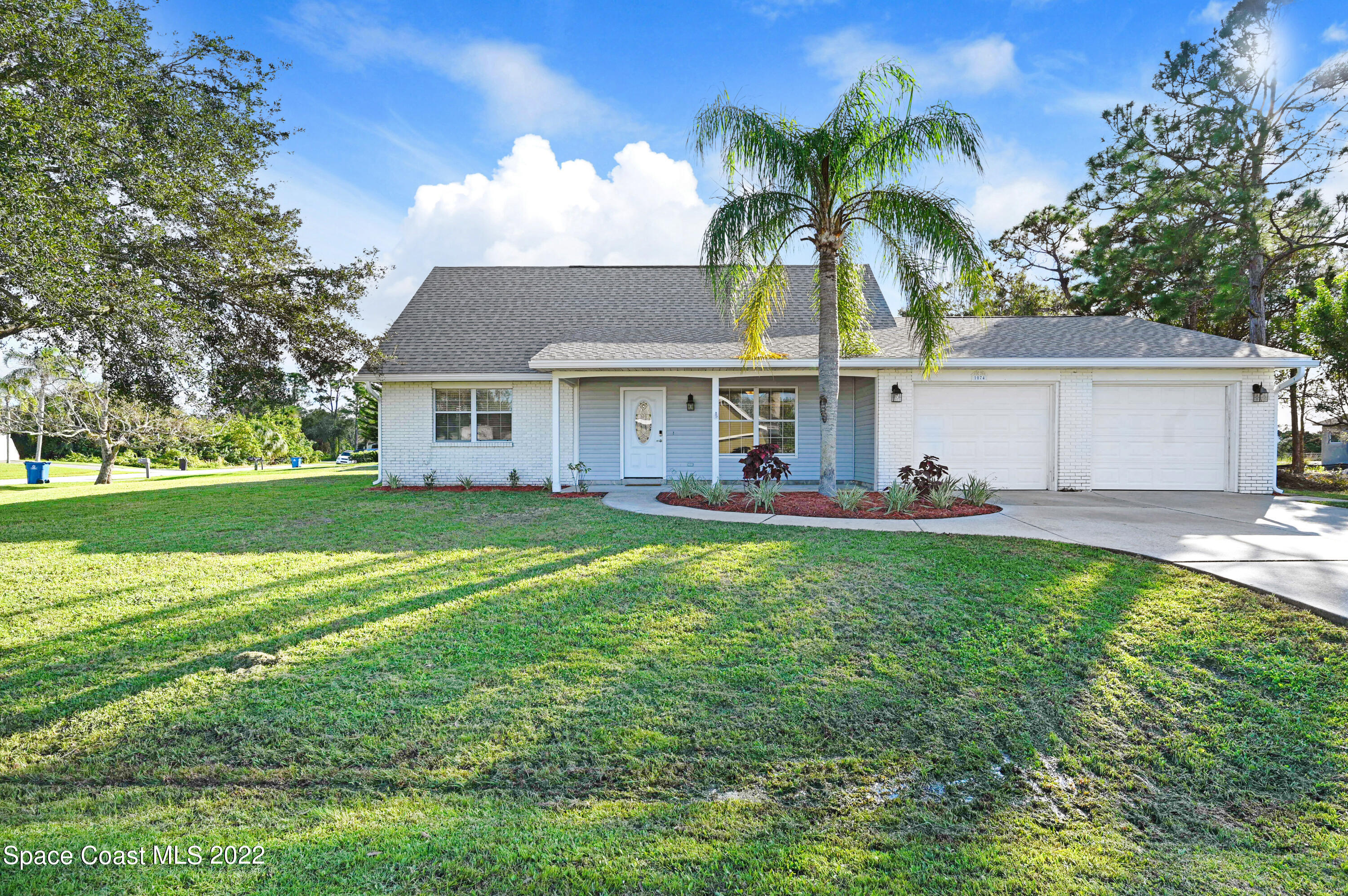 1074 Castile Road Southeast Palm Bay, FL 32909 - Photo 1 of 40 a view of house with outdoor space and swimming pool