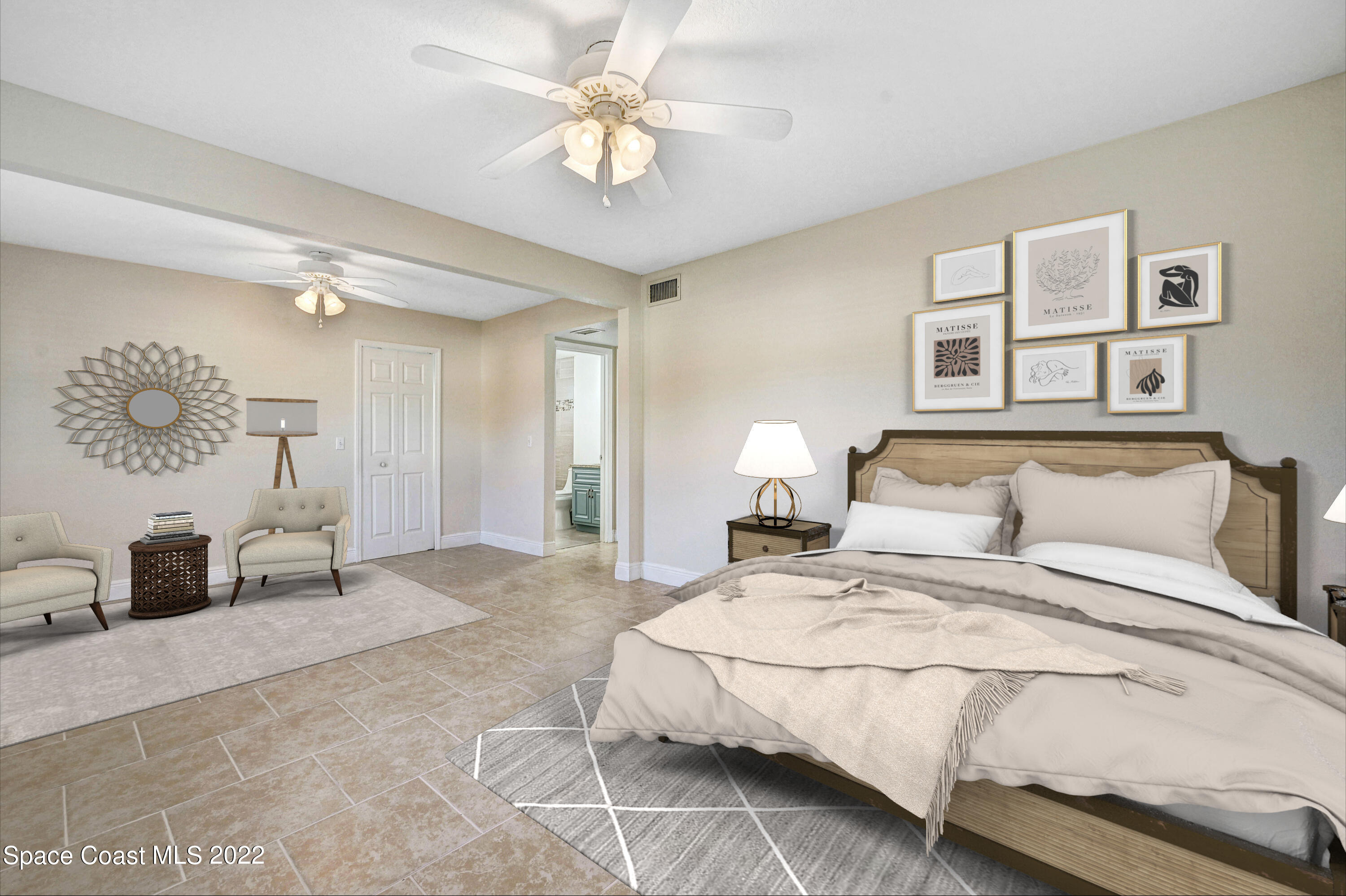 1074 Castile Road Southeast Palm Bay, FL 32909 - Photo 17 of 40 a bedroom with a large bed and a chandelier