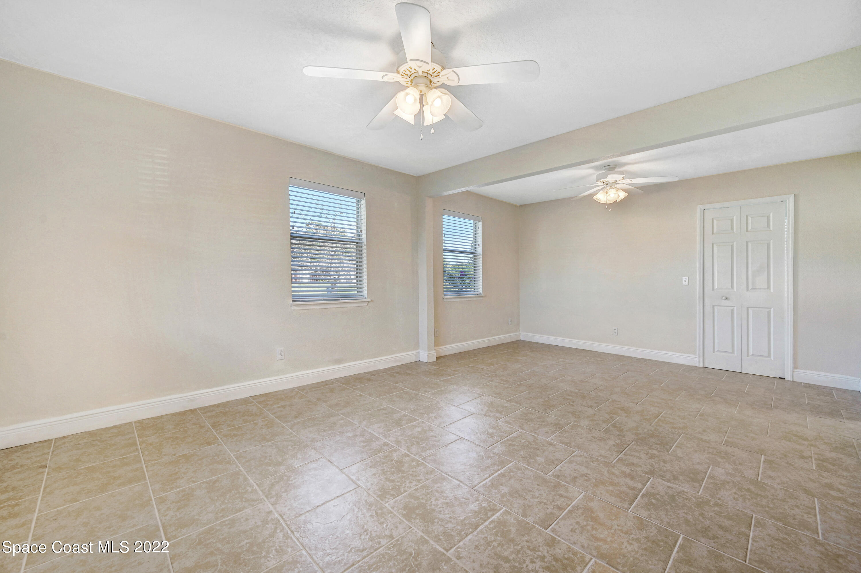 1074 Castile Road Southeast Palm Bay, FL 32909 - Photo 18 of 40 a view of an empty room with a window