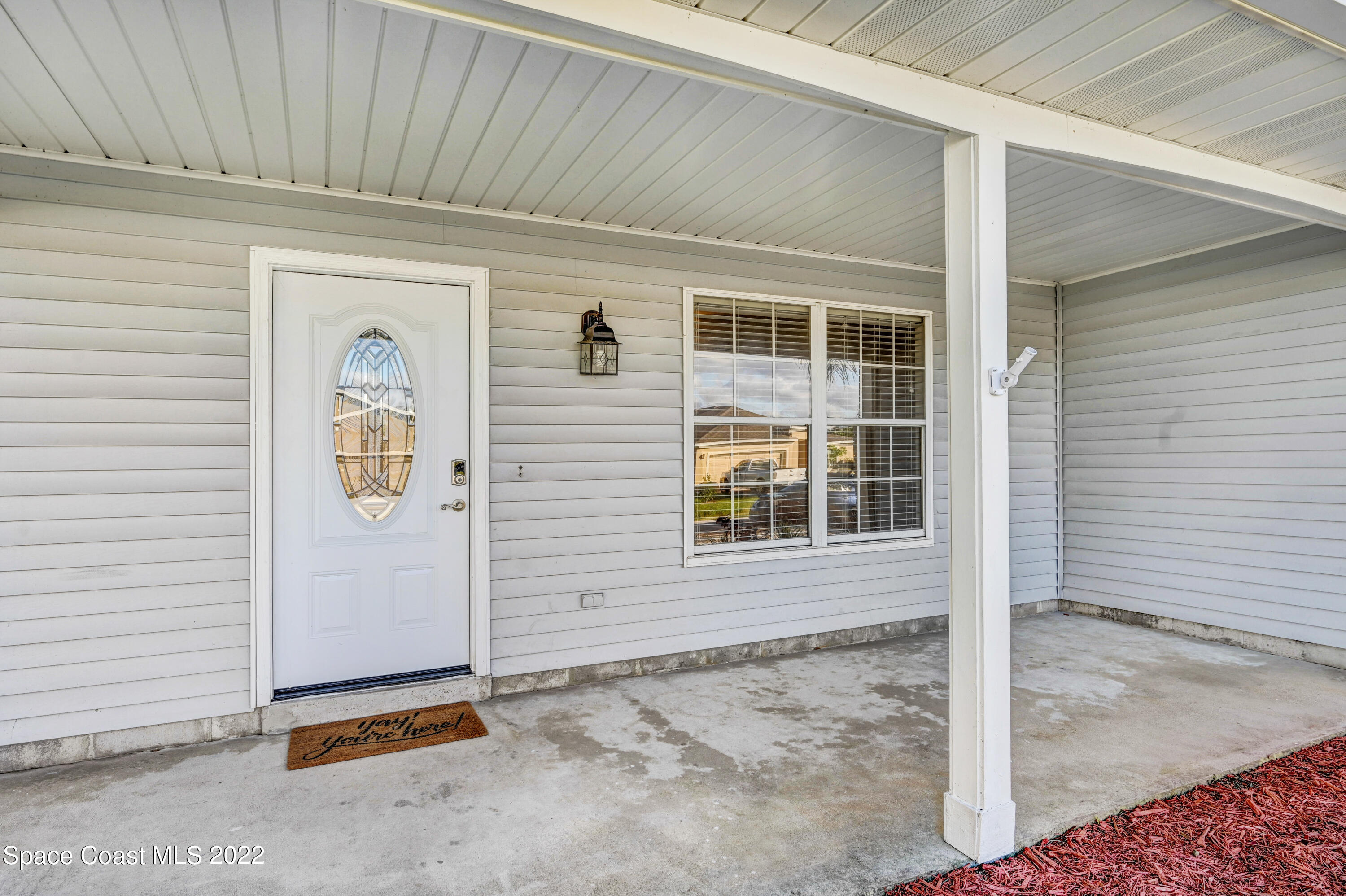 1074 Castile Road Southeast Palm Bay, FL 32909 - Photo 2 of 40 a view of a house with window