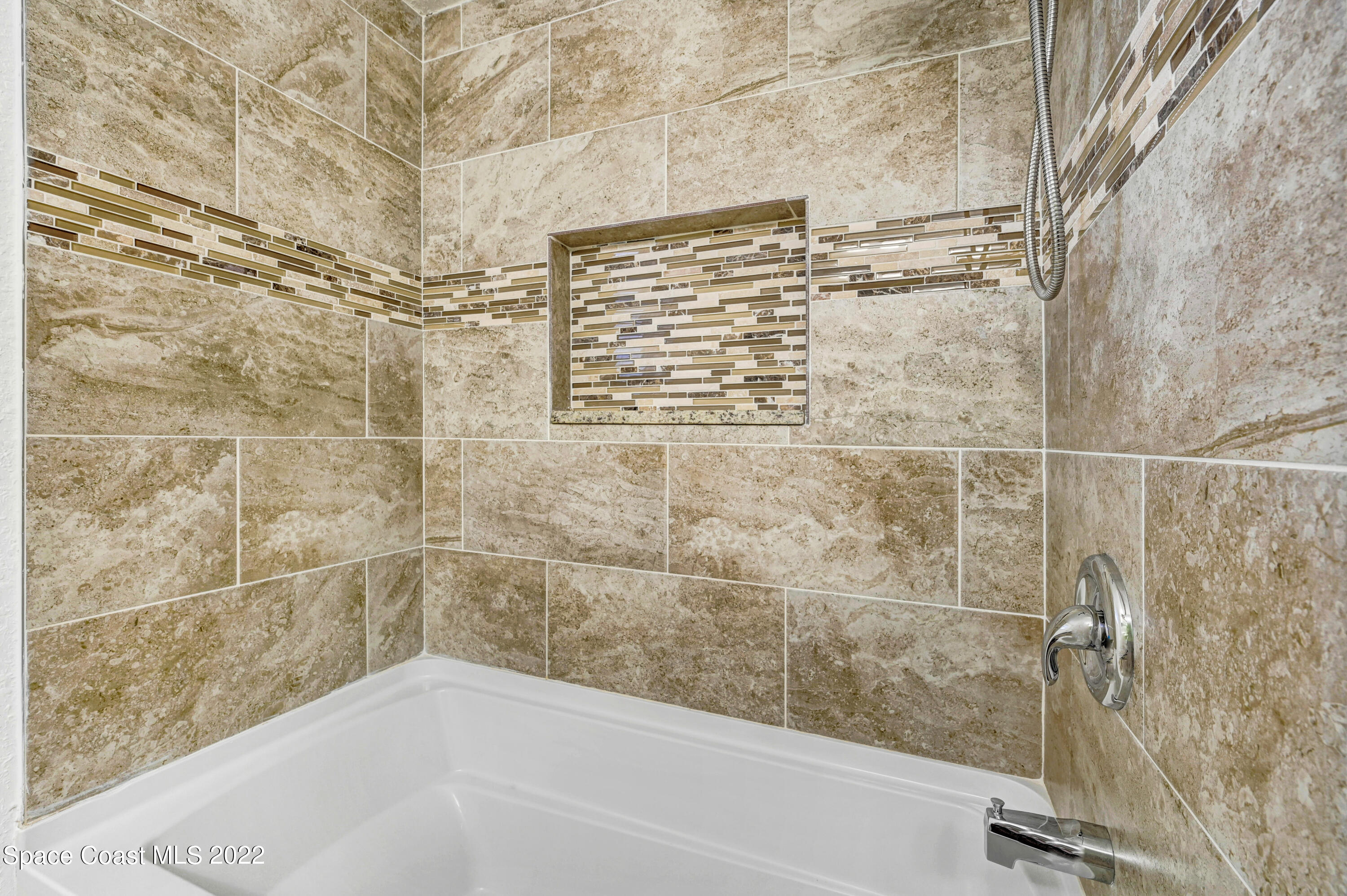 1074 Castile Road Southeast Palm Bay, FL 32909 - Photo 29 of 40 a bathroom with a bathtub