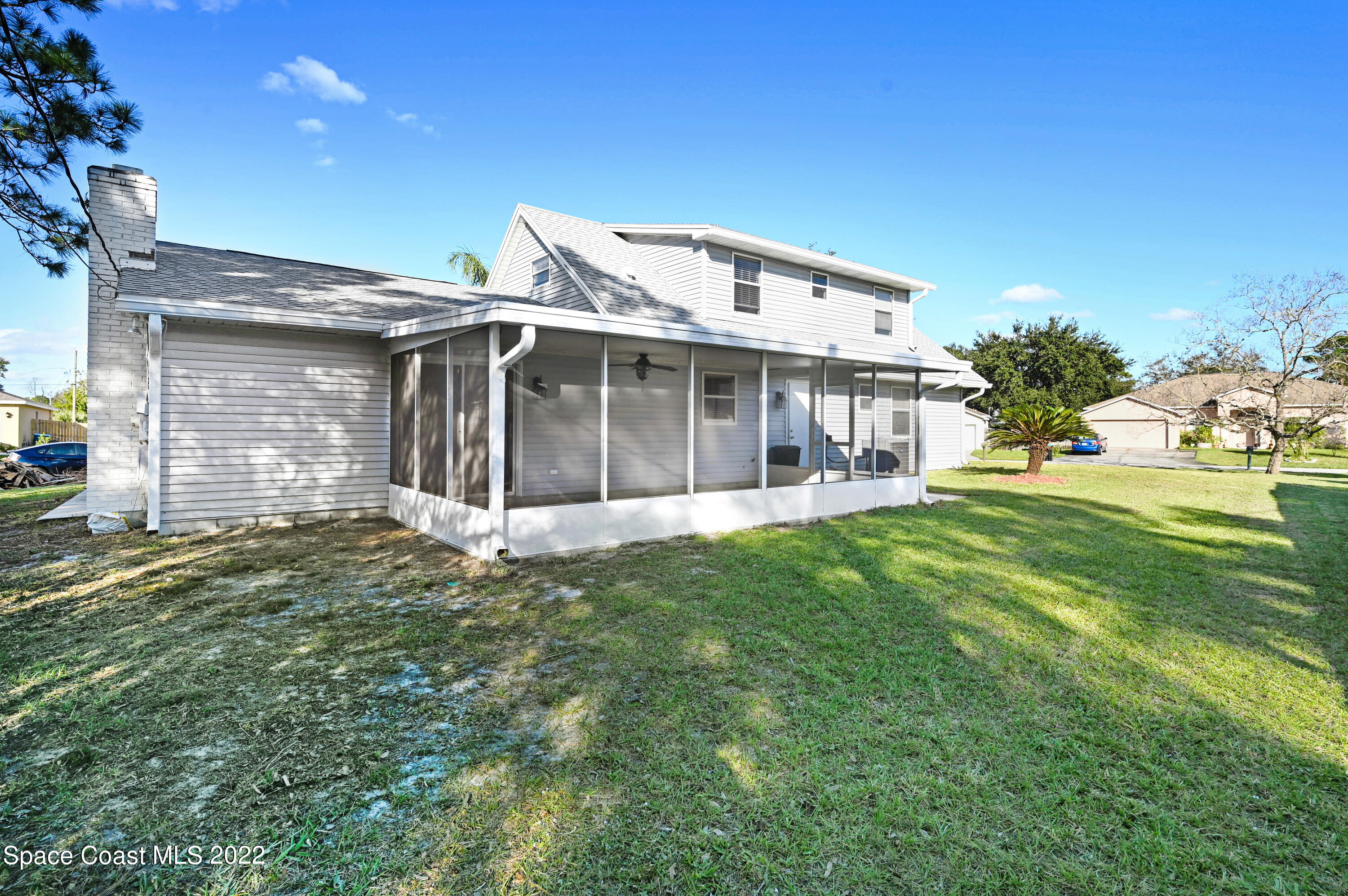 1074 Castile Road Southeast Palm Bay, FL 32909 - Photo 33 of 40 a view of a house with a yard