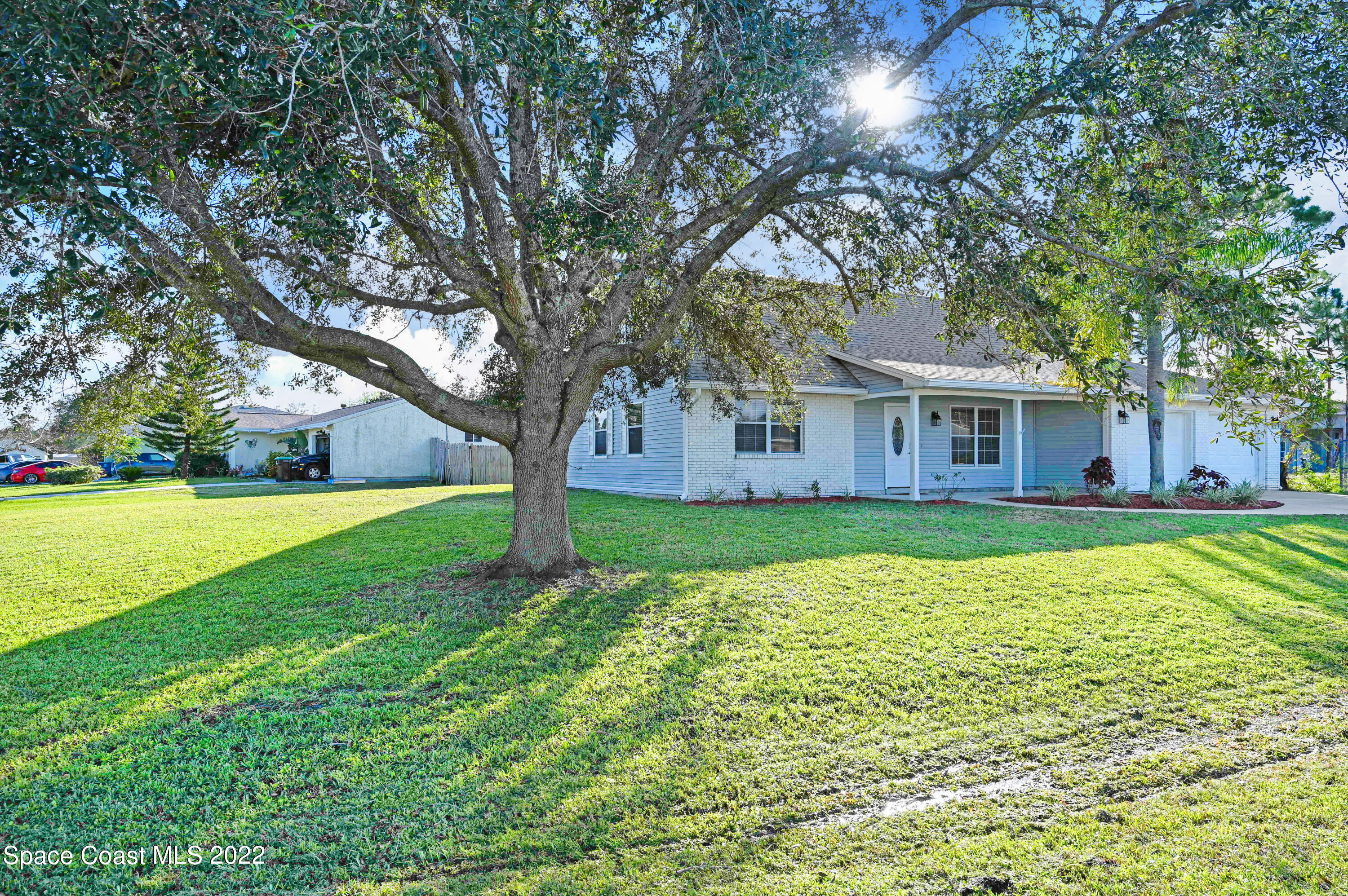 1074 Castile Road Southeast Palm Bay, FL 32909 - Photo 34 of 40 a view of house with a swimming pool