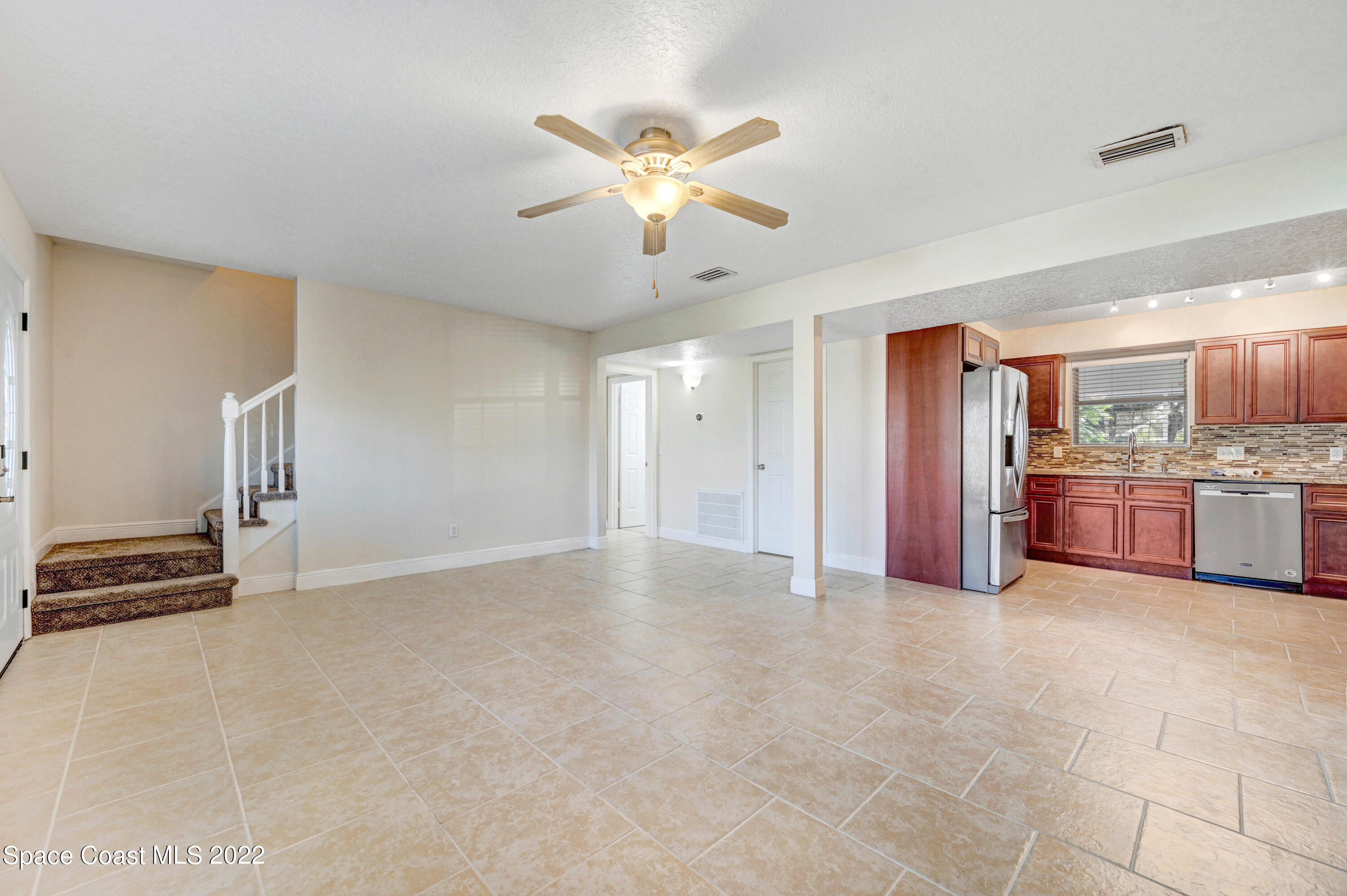 1074 Castile Road Southeast Palm Bay, FL 32909 - Photo 7 of 40 a view of an empty room with kitchen