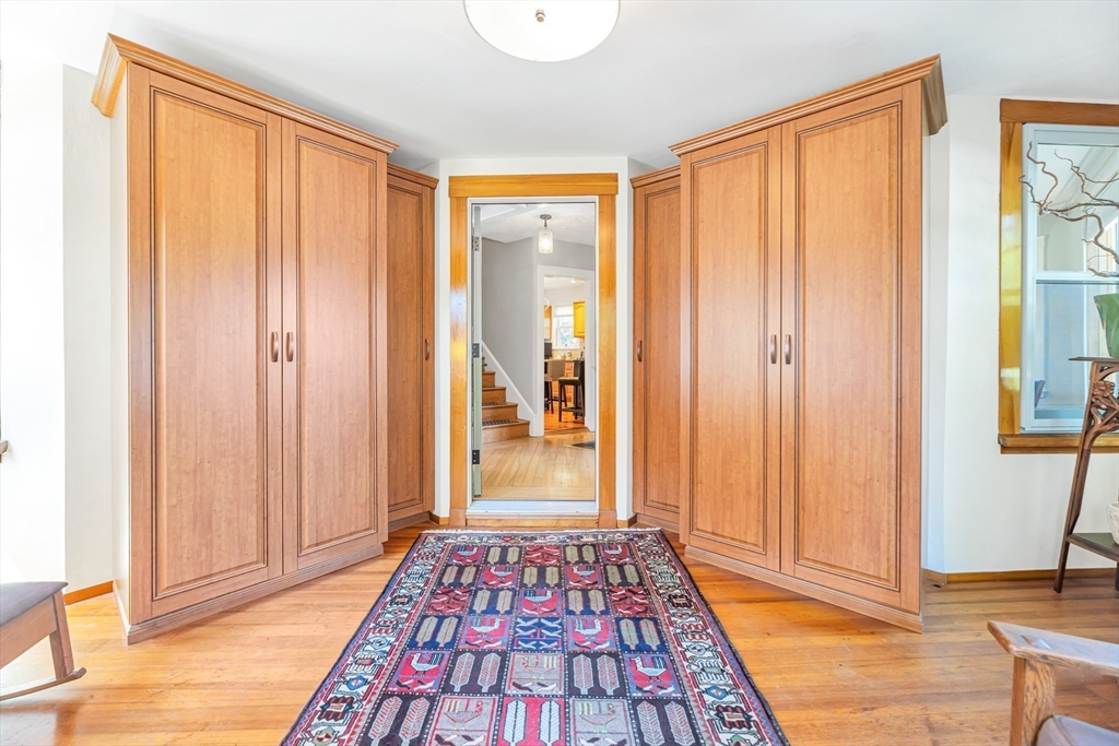 112 Perham Street Boston, MA 02132 - Photo 4 of 36 a view of a room with wooden floor and windows