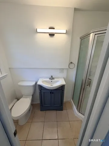 a bathroom with a toilet and a sink