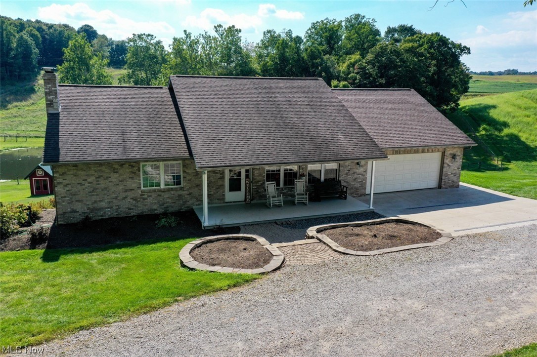 8215 Rochester Road East Rochester, OH 44625 - Photo 1 of 34 Brick ranch home custom built in 2003 with new rear deck overlooking stocked pond and countryside.