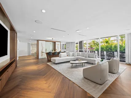 a view of a balcony with two chairs and a table