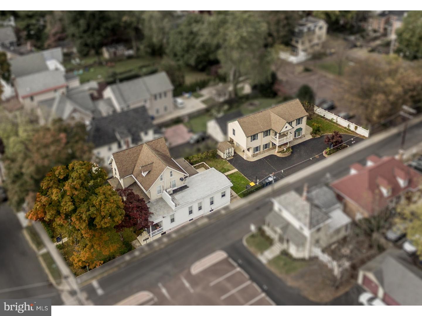 an aerial view of a house with yard