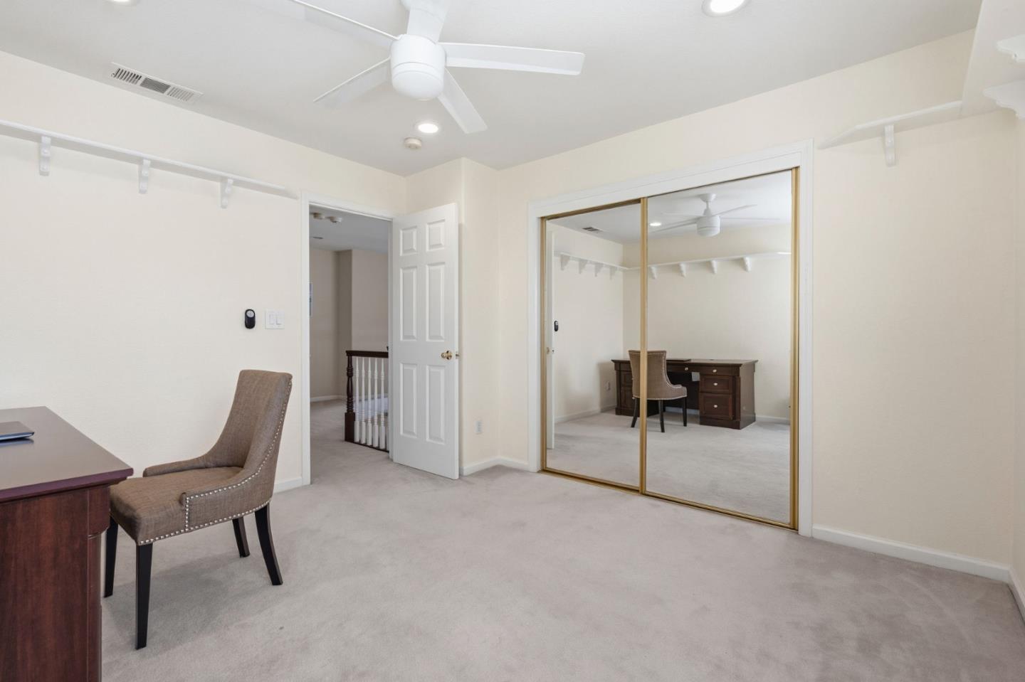 35 Sierra Ridge Court Danville, CA 94506 - Photo 31 of 37 a spacious bedroom with a chair and glass door