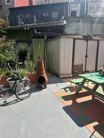 a view of a chairs and table in the patio