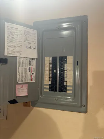 a view of a hallway with wooden floor and entryway