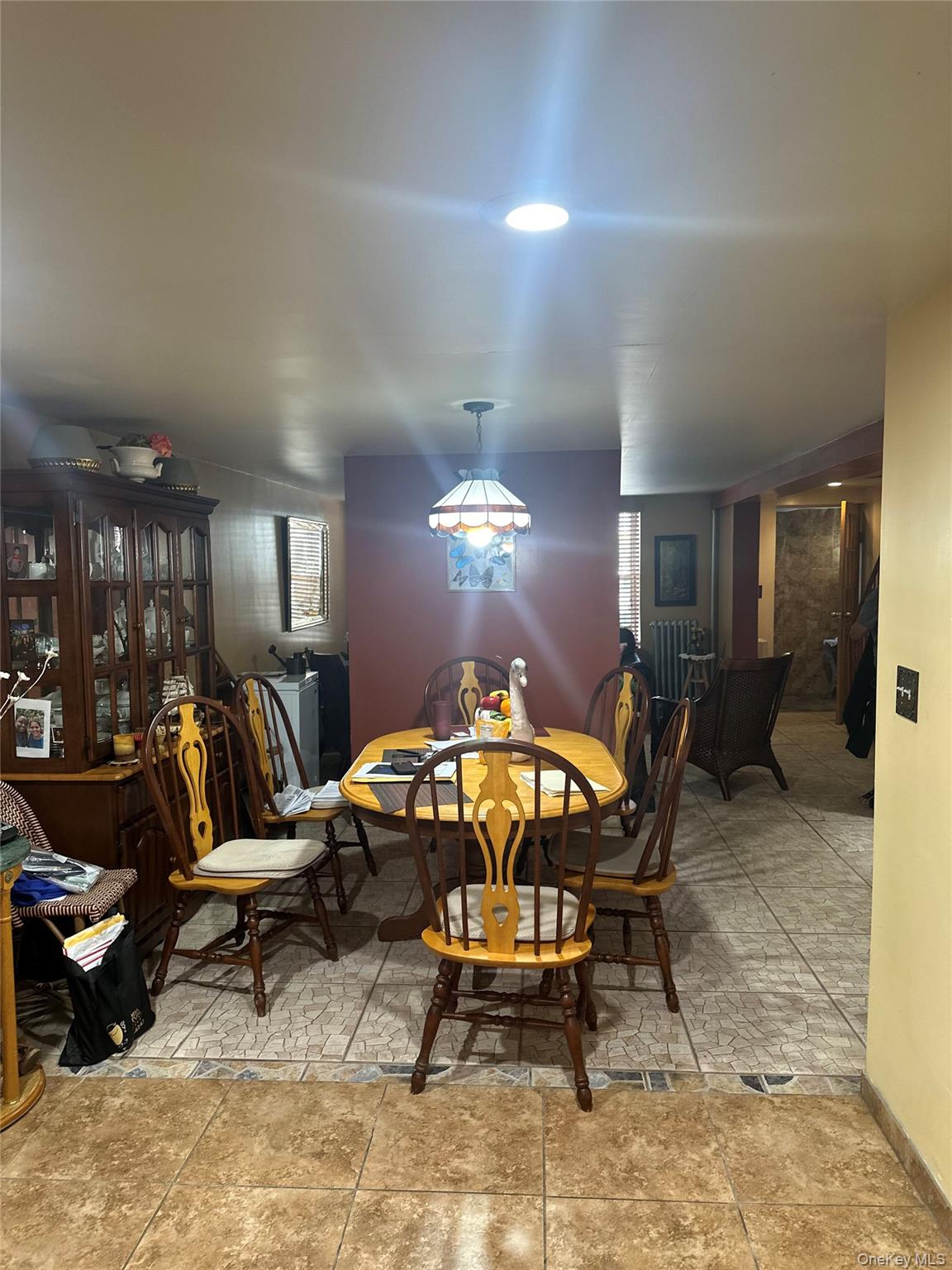 28 Maspeth Avenue Brooklyn, NY 11211 - Photo 7 of 21 a living room with furniture a dining table and a chandelier