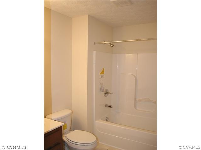 18 Winding Ridge Way Bumpass, VA 23024 - Photo 13 of 17 a bathroom with a toilet and shower