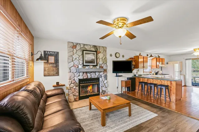 a living room with furniture fireplace and flat screen tv