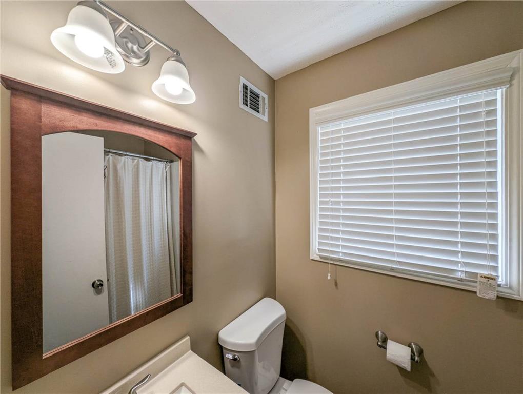 4123 Shorter Way Decatur, GA 30034 - Photo 13 of 14 a bathroom with a toilet a sink and mirror