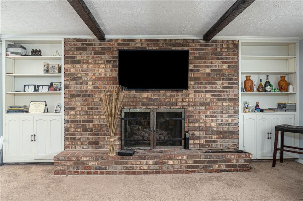 4123 Shorter Way Decatur, GA 30034 - Photo 5 of 14 a living room with a fireplace and a flat screen tv