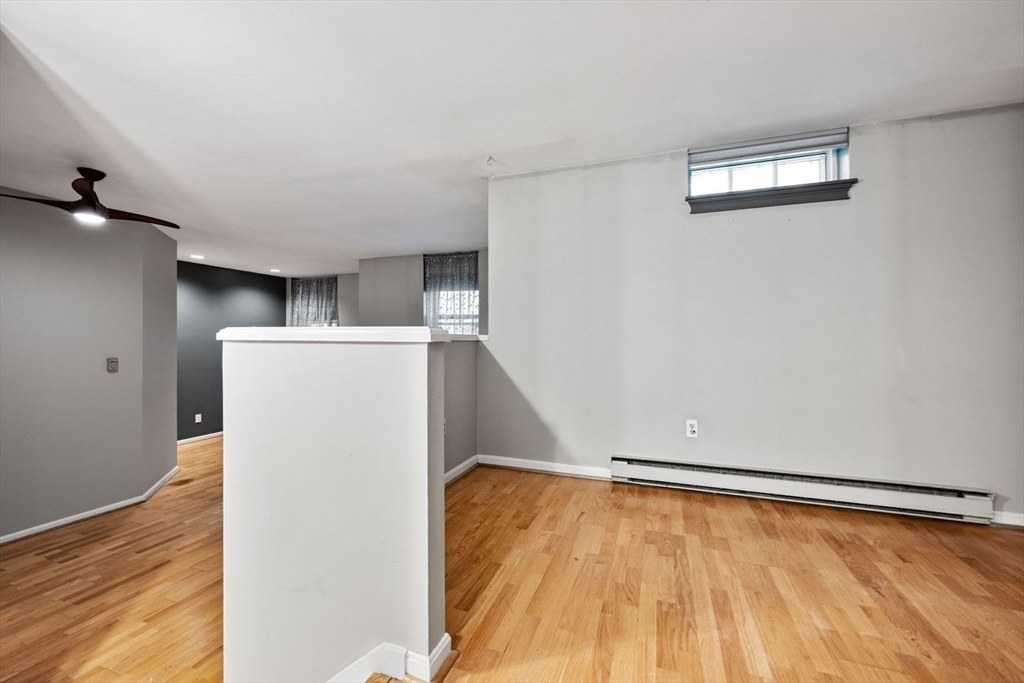 350 West Fourth Street, Unit 103 Boston, MA 02127 - Photo 15 of 33 a view of empty room with wooden floor