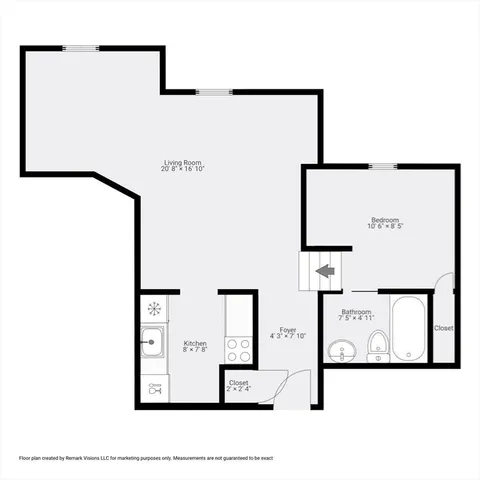 a view of an empty room with wooden floor and a ceiling fan