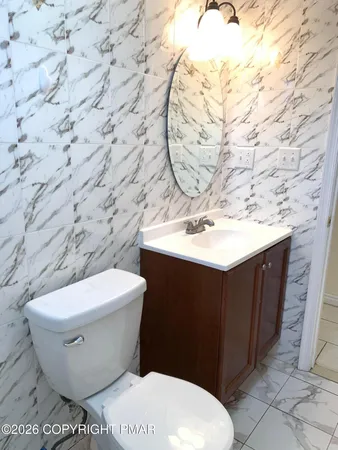 a bathroom with a toilet and a sink