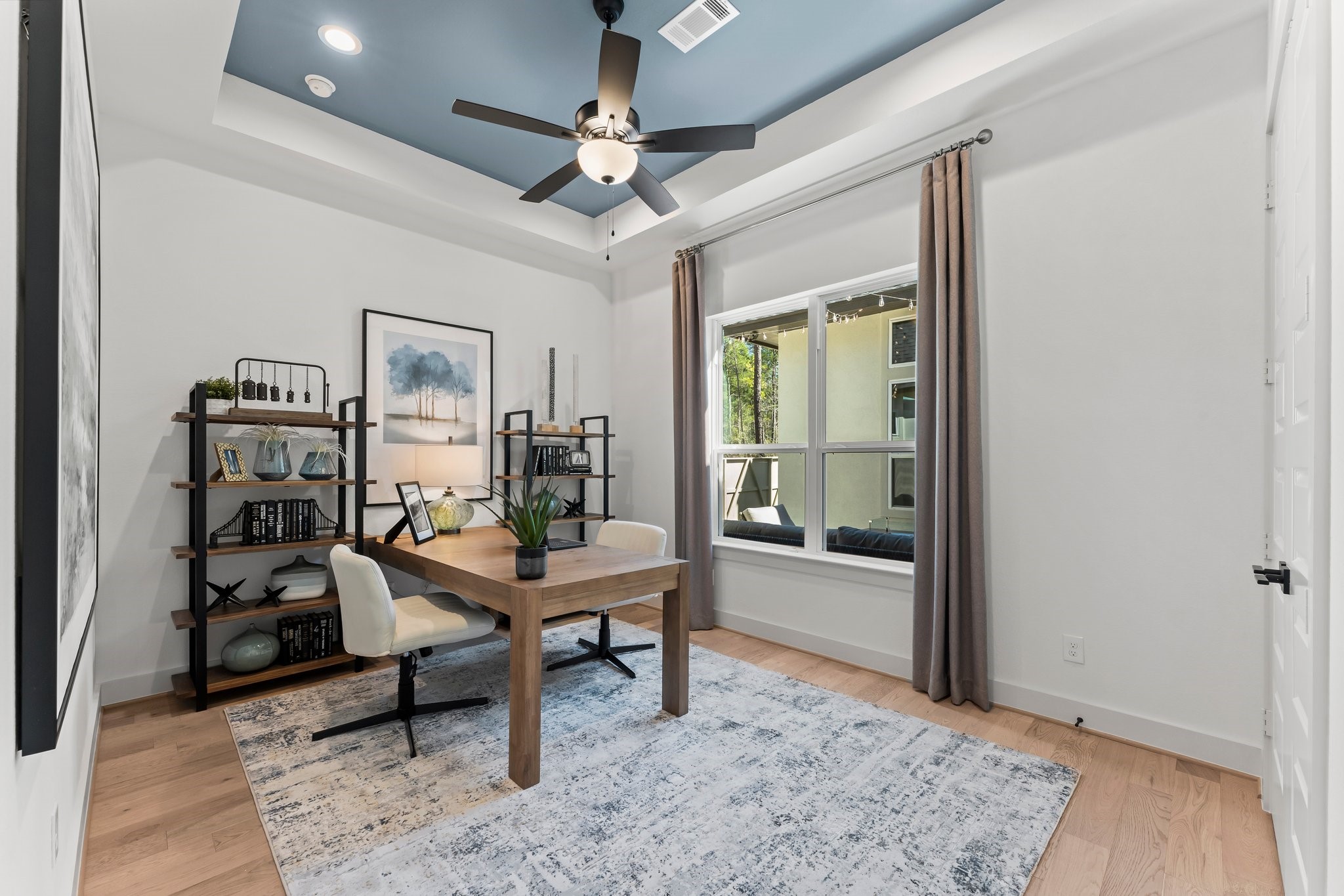 322 Marsh Wren Way Magnolia, TX 77354 - Photo 7 of 19 a workspace with wooden floor and furniture