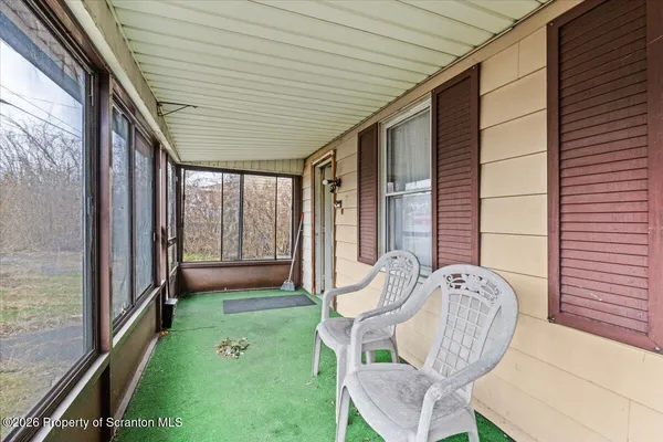 a porch with seating space