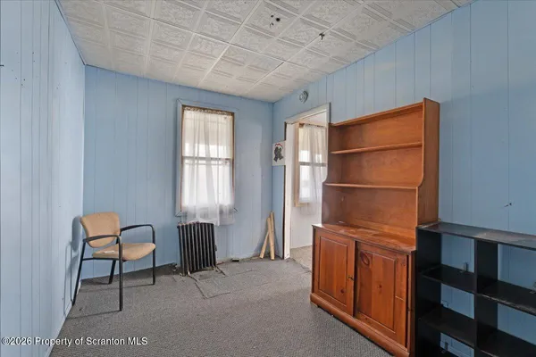 a room with furniture and a window