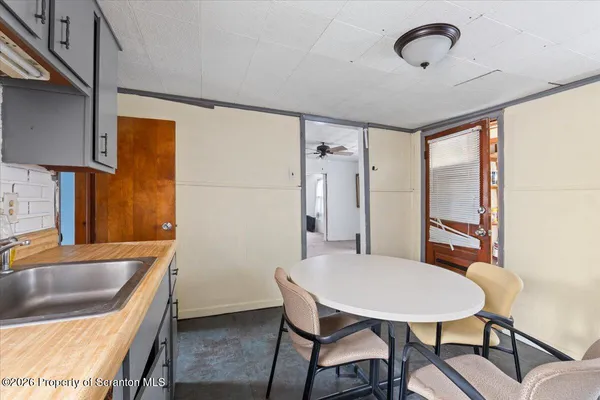 a kitchen with refrigerator cabinets and a sink
