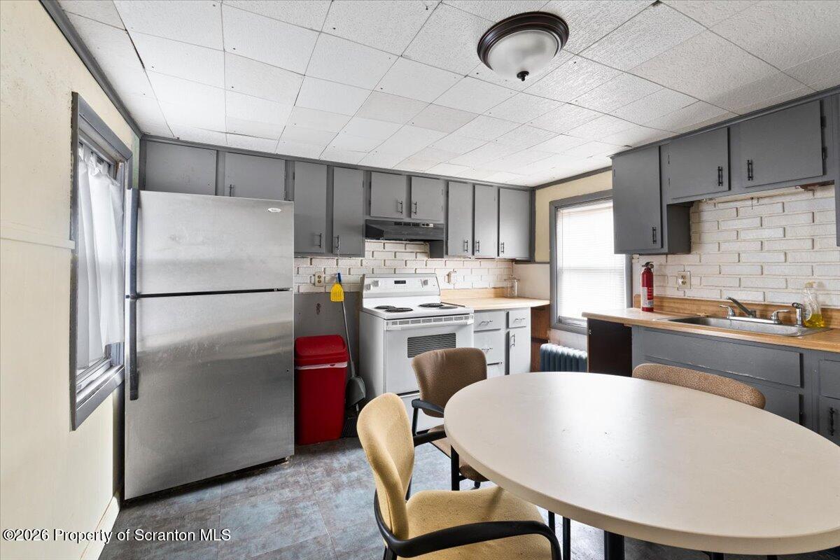 499 Meridian Avenue Scranton, PA 18504 - Photo 22 of 24 a kitchen with refrigerator cabinets and a sink