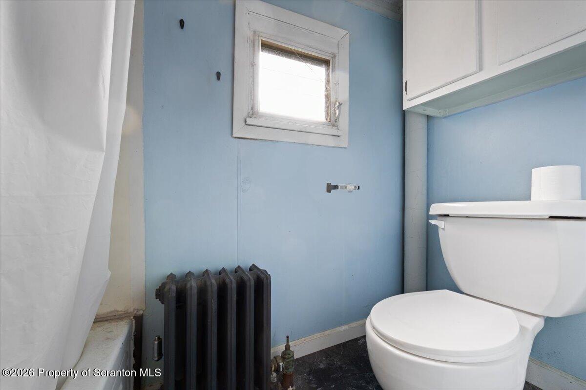 499 Meridian Avenue Scranton, PA 18504 - Photo 24 of 24 a white toilet sitting next to a window