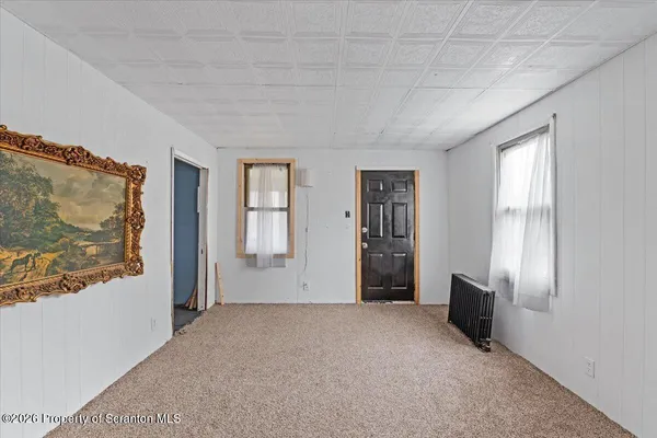 a view of livingroom with furniture and window