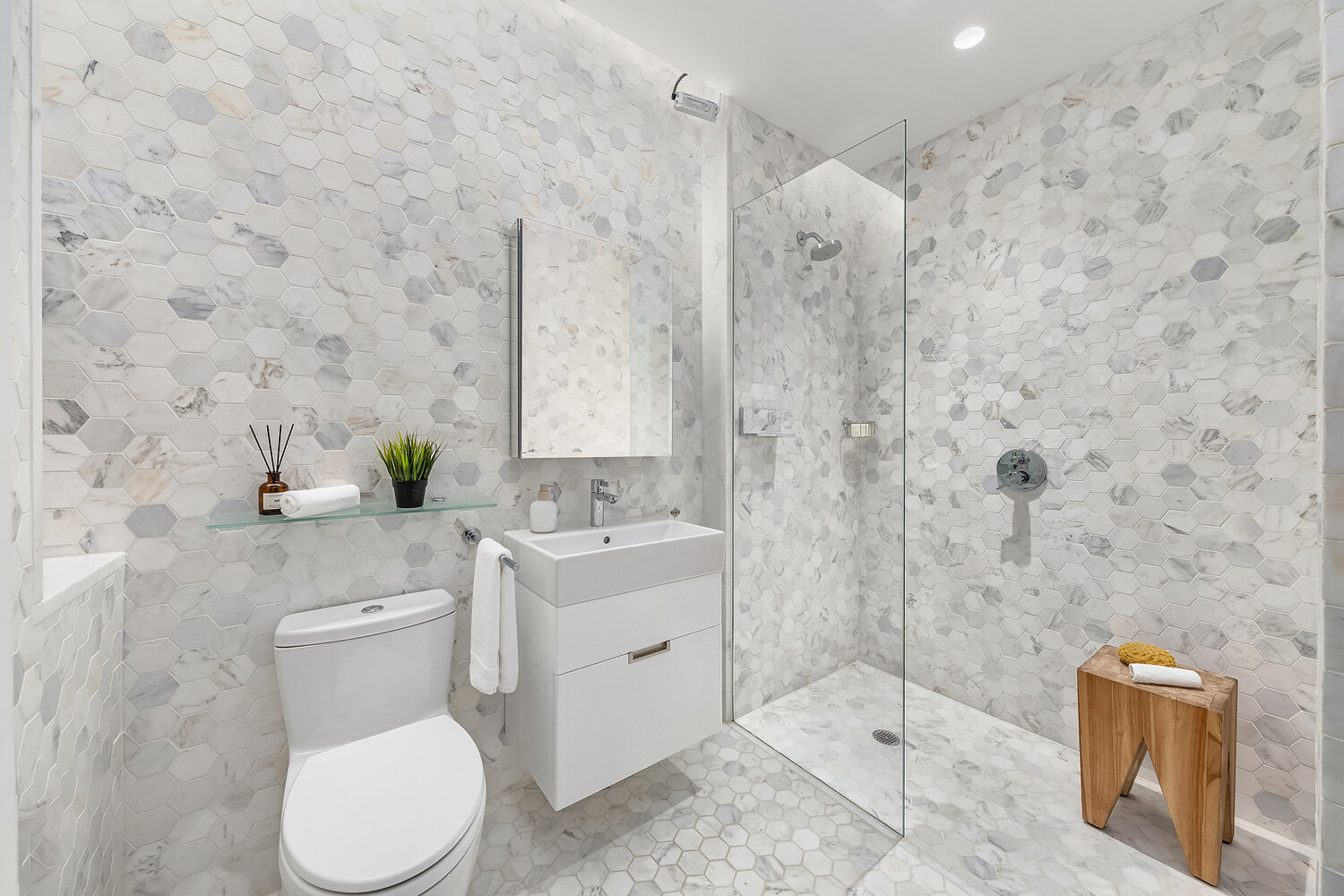 325 West Broadway, Unit 7B Manhattan, NY 10013 - Photo 13 of 19 a bathroom with a granite countertop toilet sink and mirror