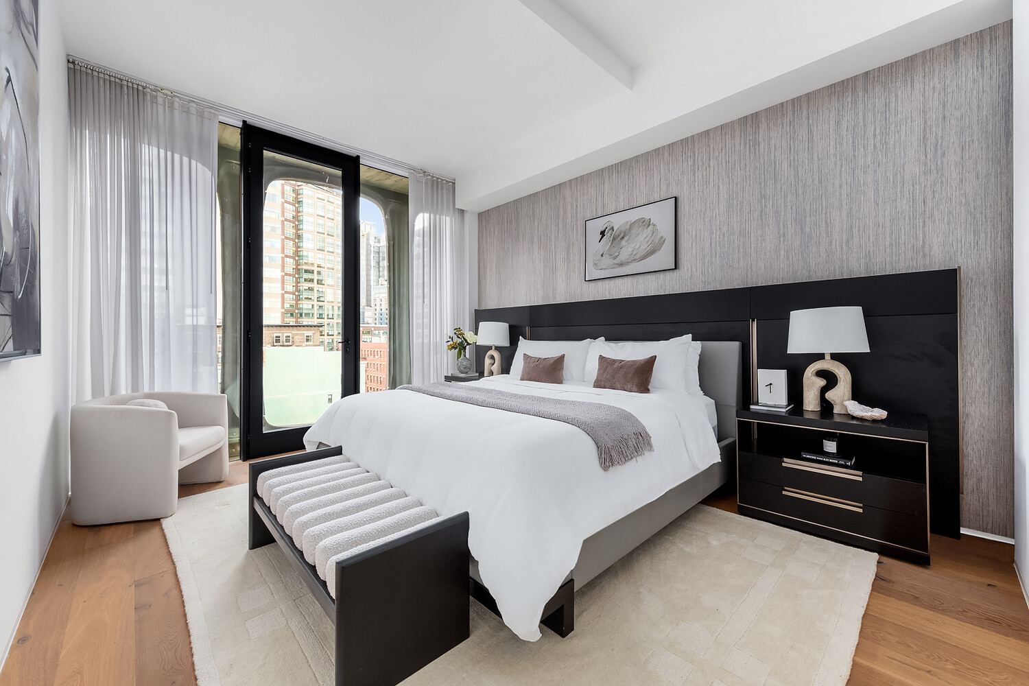 325 West Broadway, Unit 7B Manhattan, NY 10013 - Photo 6 of 19 a bedroom with a bed and wooden floor