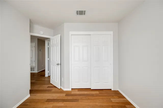 a view of a livingroom with wooden floor